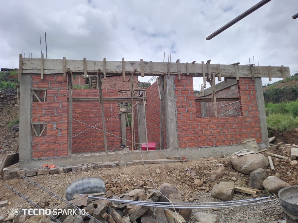 The framing of a house in Bolivia, built by BUYONE BUILDONE.