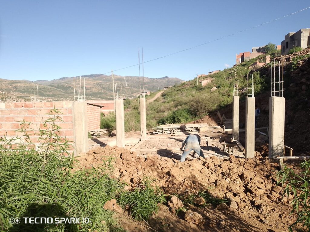 A man building a house in Bolivia with BUYONE BUILDONE.